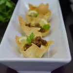 samosa cups, samosa, minced meat, canapes, white plate, coriander, black muffin tray